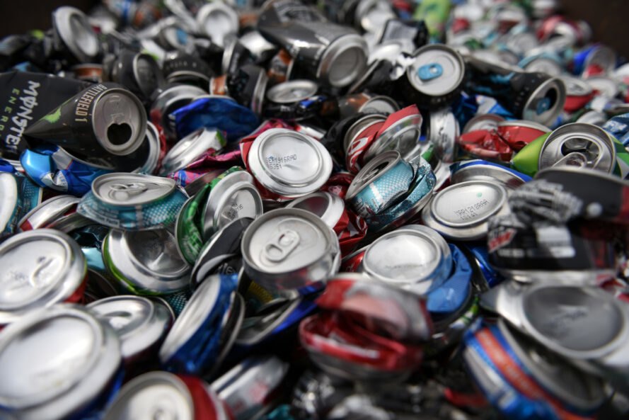 pile of compacted aluminum cans for recycling