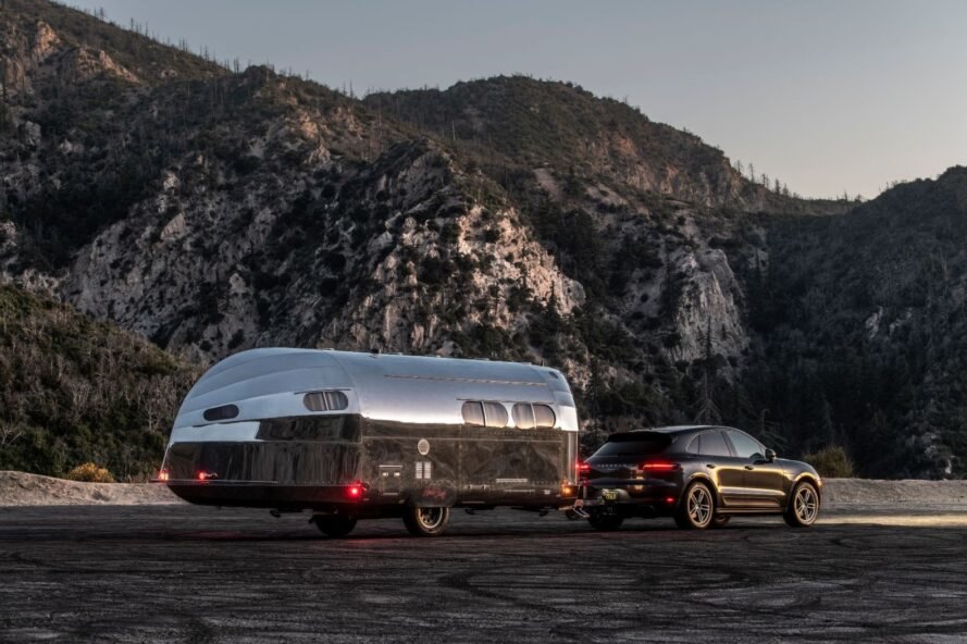 SUV pulling a metal-clad travel trailer