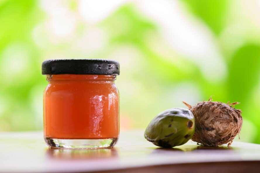 jar of natural medicine next to fruit