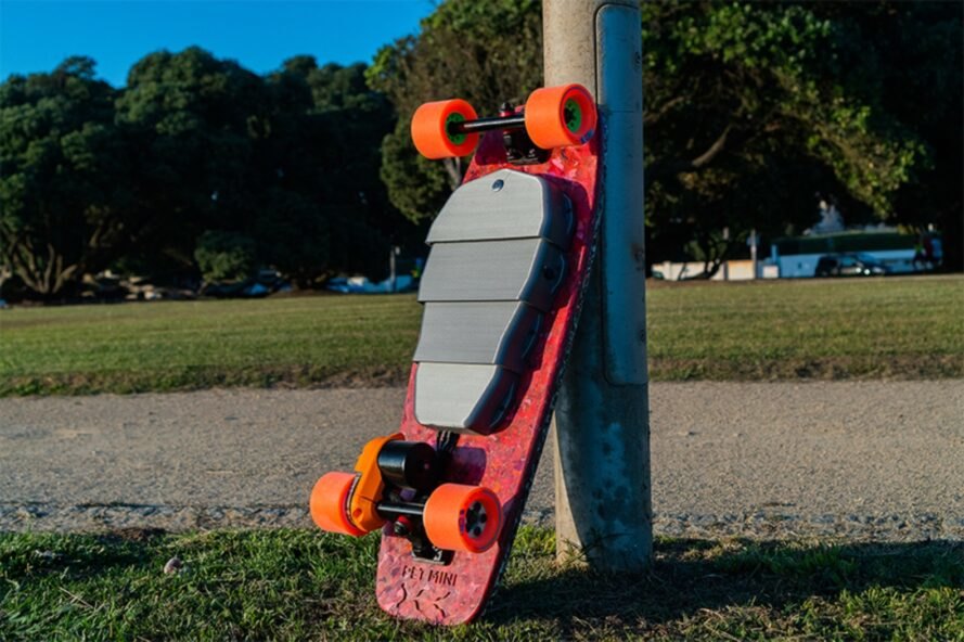 skateboard with small gray enclosure underneath