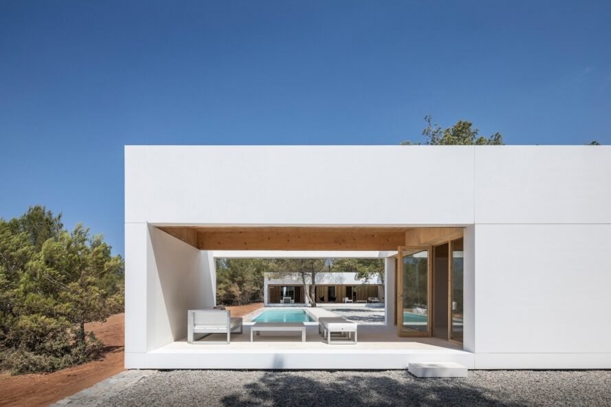modern, cube-like structure with open walls and covered lounge chair area